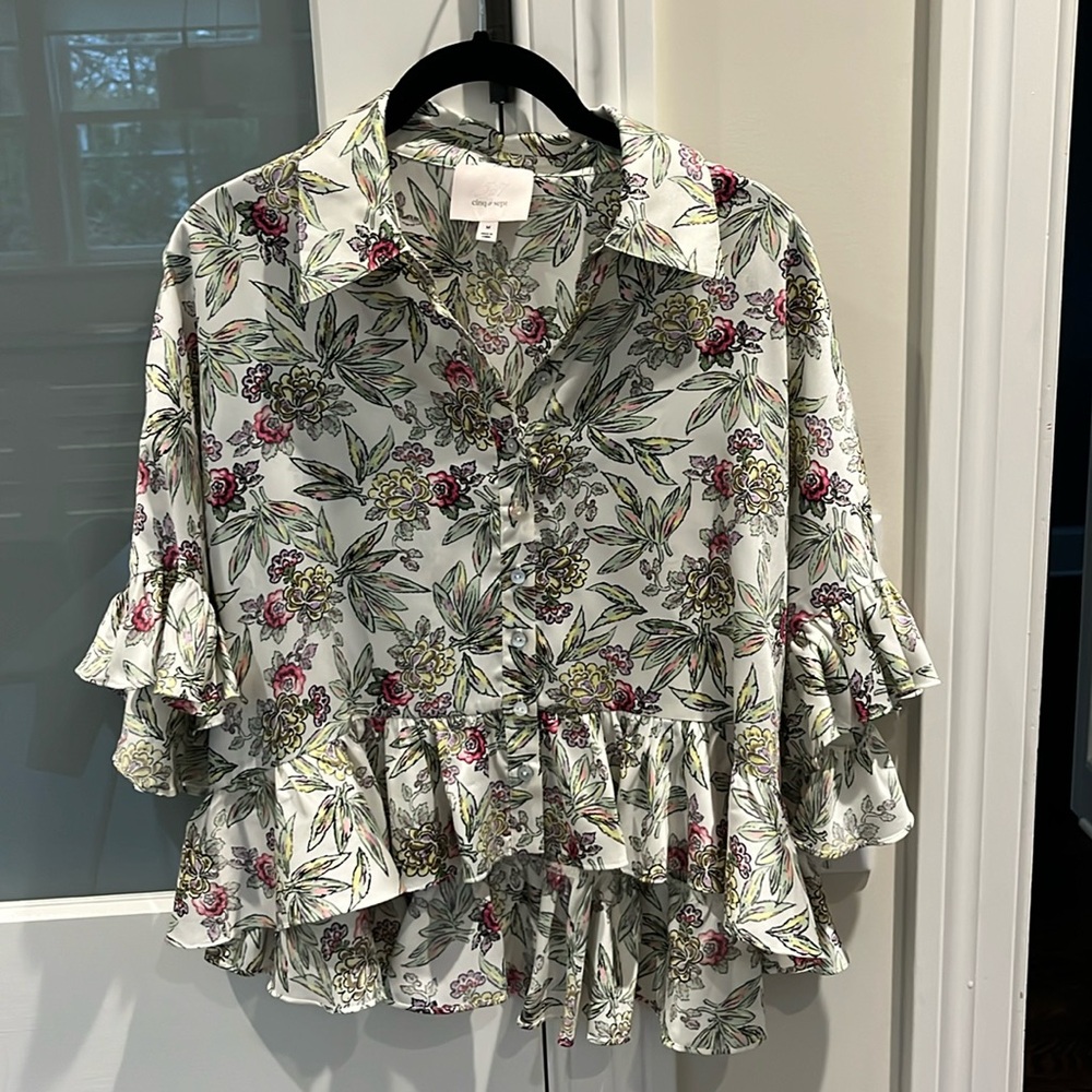 Great looking colorful blouse with peplum